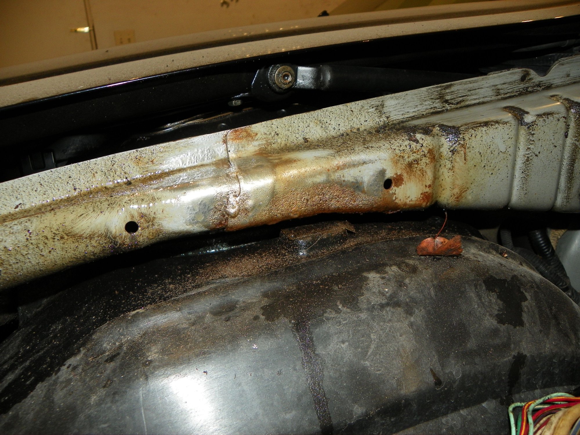 Used a drill with a wire brush attachment to clean some of the rust
