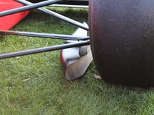 Notice the front wing vortex channel duct inside the tire/wheel to keep the dirty air from the undertray