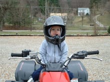 My boy looks like he is ready to go riding.  He has a Little battery powered atv that he rides at my parents property.                                                                                  