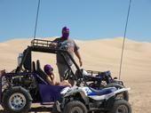 We brought our friend and neighbor to the dunes for the first time. He's dressed to the nines as a super hero. &quot;The Purple Sand Flea&quot;
