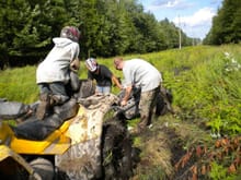 me pulling the the polaris out of another mud hole- (this was the theme all week long- I was pulling the polaris &amp; suzuki out of mud holes at least 4 times a day!)