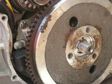 Flywheel with the Magnetic pickup sensor on the left behind it.