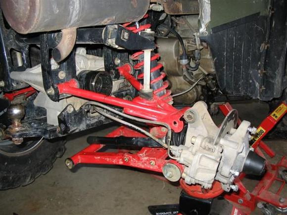 Pic of the A-arm and drive shaft out to change inner CV Boot.                                                                                                                                           