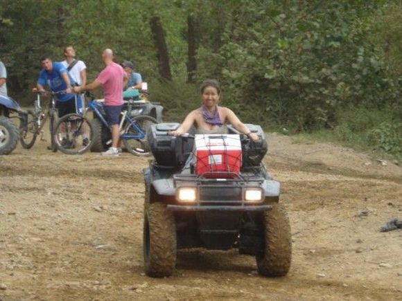 Rebecca driving the Cat around. She looks tiny on that thing.                                                                                                                                           