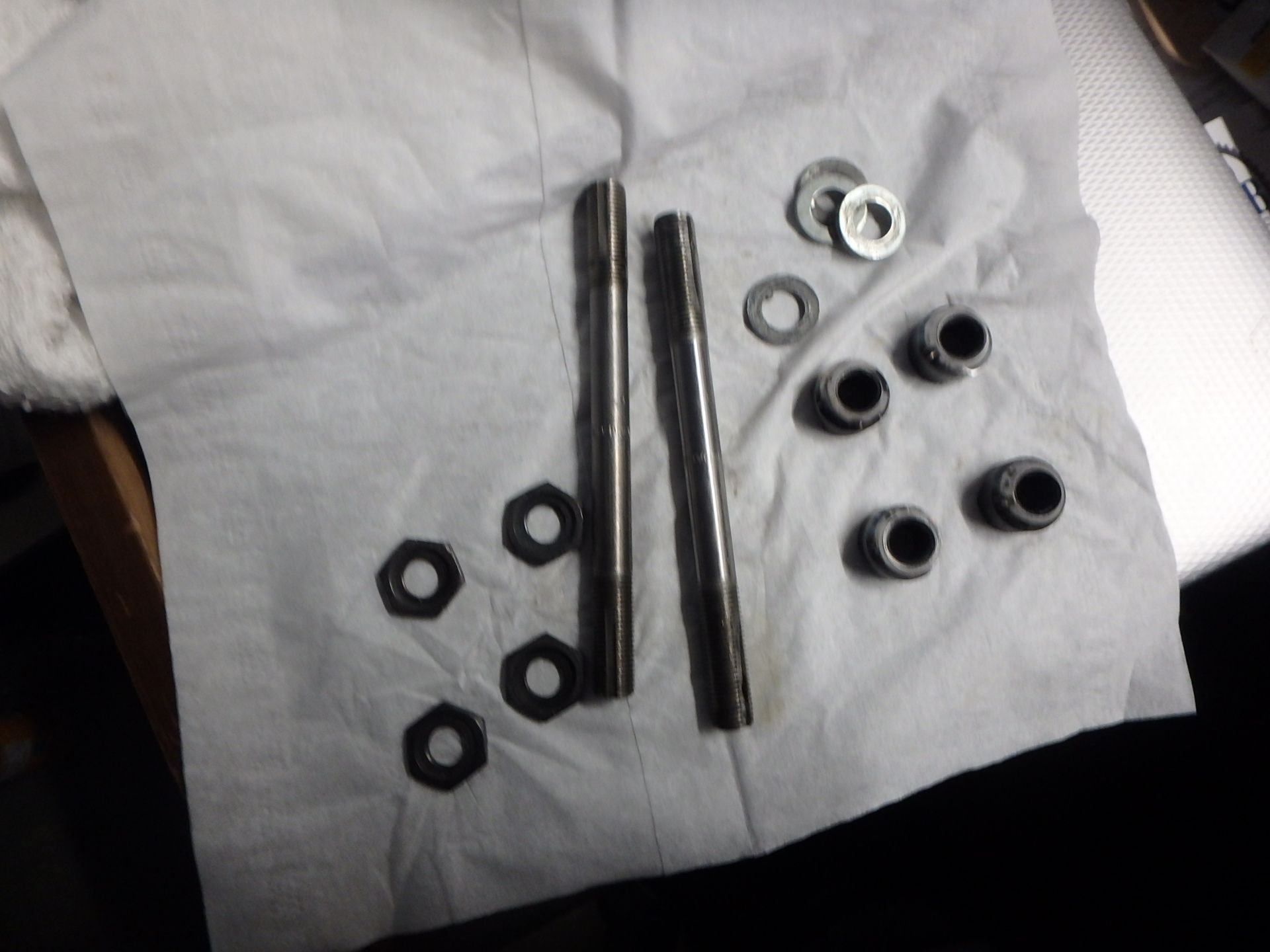 Lock nuts, axles, cones. and washers.