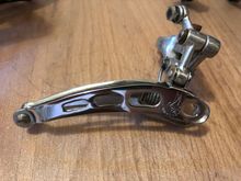 This is the '78 year only front derailleur, with four holes, rather than the later 3. It has the front "lip" per CPSC mandate....