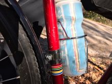 awesome. Works great. A smidge big for modern bottles, but looks super. 
Put a bit of gorilla tape under the clamp to protect the highly scratched up 42 year old frame. 