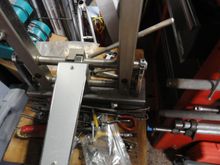 The slide bars hold the uprights stable and have heavy bearings in the uprights.  The slide is a single control bar for actuation utilizing an offset pair of control rods.  