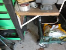 Home made side shelf on one of my cabinets. Note the vise  mounted and the heavy duty shelf brackets.   This is on a MAC three drawer cabinet with a slide open top for additional storage.