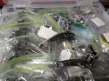 The box of reconditioned front derailleurs.  I picked one that ad damaged threads when it came fir the cable binder bolt.  I re-tap the arm to 6X1 and use a button head stainless bolt to replace the original.