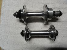 Lighting is not the best but they have some bling left in them.  Rear measures in at 124 so there may be some extra room if you are spreading the stays.  FW clearance is enough for a potential seven speed normal spacing but would definitely handle a seven ultra.  
