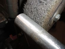 Seat post meets Mr. 3M buffing wheel that I normally use to refinish bottoms and faces of Titanium driver heads.  It is a bit aggressive and does remove about one  thousandth of an inch from the outer surface of the aluminum.
