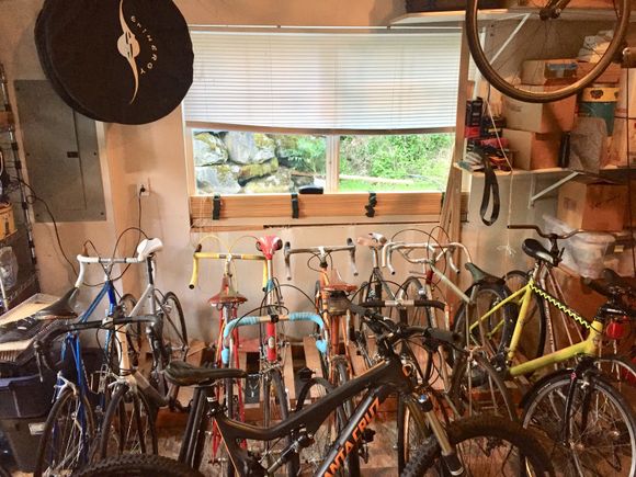 Not a man cave.  But practical storage.  Separate single stand for son’s mtb. 

I didn’t think to take a pic during asst.