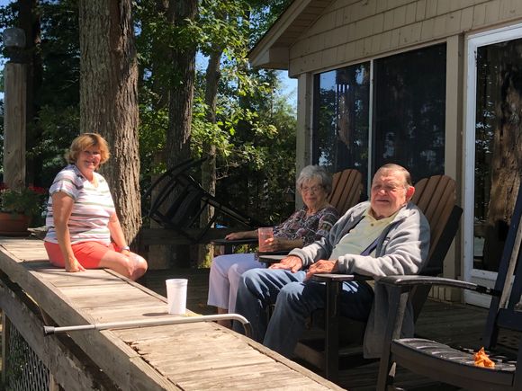 My super sag lady and her parents rocking on their deck watching all the water craft parade by.