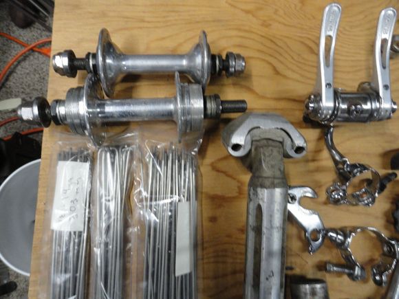 By quarter boards.   Set of track flip flop hubs and spokes from a set he asked for months ago.  Not a BOC item but from me.  Seat post, shift levers hanger and cable guides.