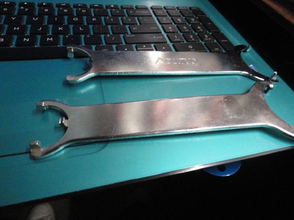 After checking out pics of the BB, I dug these out of the tool box, and they are likely what you need for one side of the BB.
My junk yard tool will remove the other cup if this one doesn't work.