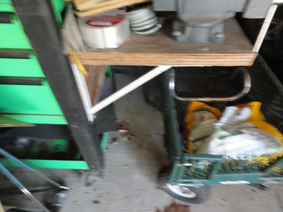 Home made side shelf on one of my cabinets. Note the vise  mounted and the heavy duty shelf brackets.   This is on a MAC three drawer cabinet with a slide open top for additional storage.
