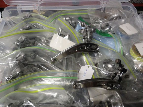 The box of reconditioned front derailleurs.  I picked one that ad damaged threads when it came fir the cable binder bolt.  I re-tap the arm to 6X1 and use a button head stainless bolt to replace the original.