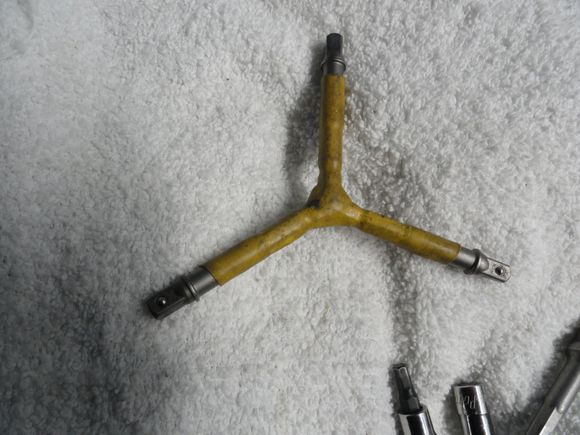 My three way wrench that can use either hex bits or sockets.  This one is 1/4" drive but A 3/8" drive can be fabricated. the same way.