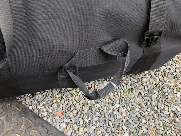 Upon arrival, the lower carrying handle's stitches failed. I removed it. For me, it served no purpose. 