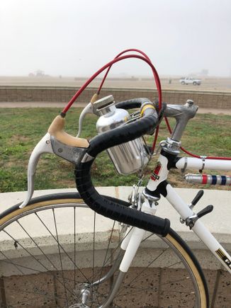 Bar tape is original so I left it as is. The Colloral water bottle was attached with zip ties but and taped over. I''ll need some clamps but this will do for now. Tires are Vitoria Corsa Tubulars pumped to 120 psi. They ride ok,  but wonder if there are better tires out there.  