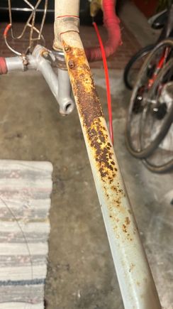 All I did was quickly scrub it with a mildly-soapy brush, and toss it in an oxalic acid bath (sold in many hardware stores as wood bleach, roughly 1 tbs per gallon).