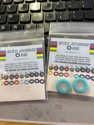 It's the small details that sometimes make a bike stand out.  I really wish I could find some dark blue rings like this.