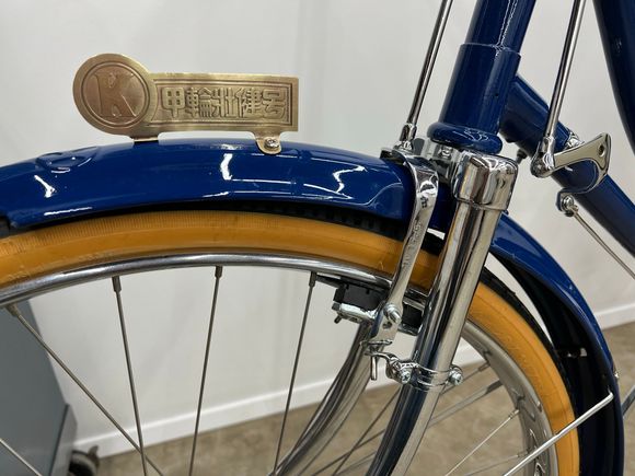 Close-up of brakes and fender badge