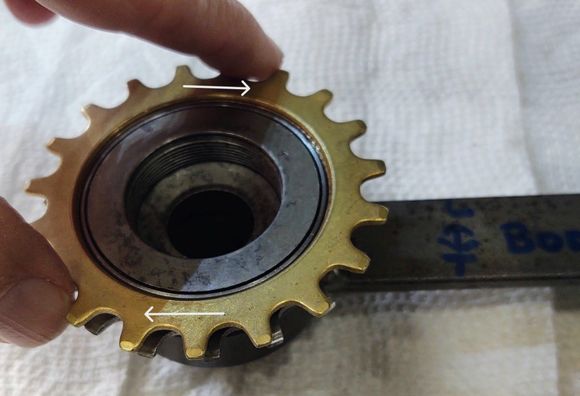 8. Clamp the tool in the vise.  Using a chainwhip on the largest sprocket, tighten the body against the stop. The sprocket is reverse threaded and should begin to loosen.  If it doesn't soak the threads in penetrating oil and wait over night.  Repeat and use heat as needed.