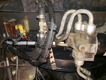 View from below showing my supplemental transmission cooler lines. In the far left of the radiator you can see where I used a zip tie to secure the bottom fan shroud to the bottom of the radiator using a hole in the radiator frame, I did this at the center and on the driver side. too.