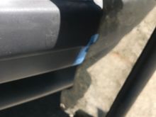 The very bottom that mounts somehow to the tow hook area