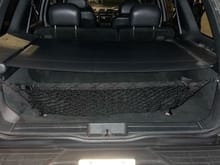 Luggage cover with cargo net