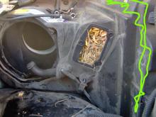 Opening for the blower motor mount (on left) and opening for blower motor control module (for the Auto-Temp/Climate control systems) in the middle with the leaves and needles. The green marked areas are the upper and forward edge of the AC condenser.