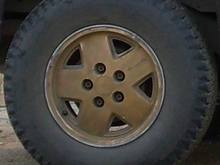 Golden rims (as I bought it) with Sumitomo SL830 LT235/75R15 M S tire