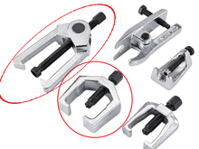 The tools used to disconnect the pitman arm from the centerlink (upper left) and to disconnect the pitman arm from the steering gear (center bottom)