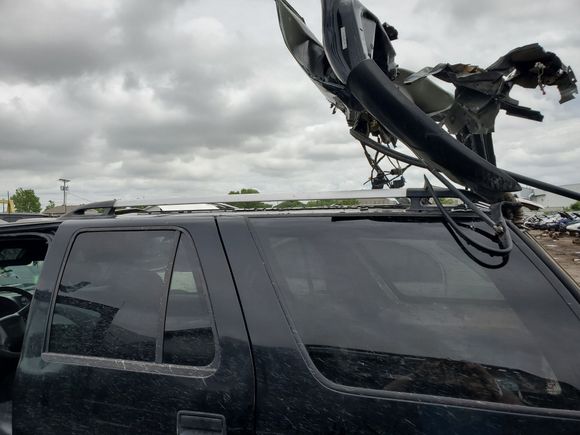 The stainless cargo rack was bent from rear door being smashed upward.