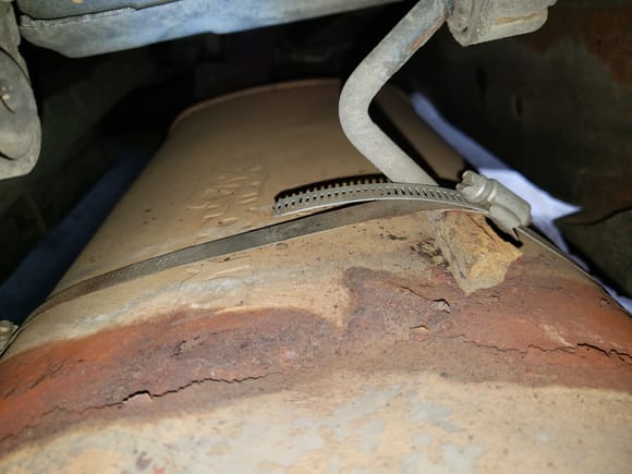 This is where the original strap was located. I might install the replacement muffler with stainless steel hose clamps again so that salt cannot get trapped under the original style strap.