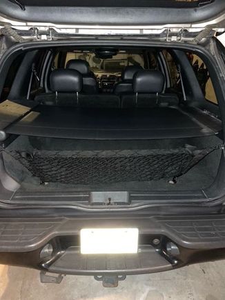 Luggage cover with cargo net