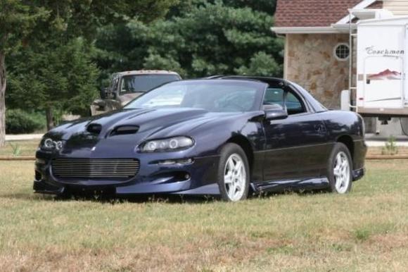 Exterior~WS6 Style Ram Air Hood, Zenon Lip Kit molded to body, Billet Grill, Projector Head Lights w/ Matching Style Tail Lights, Clear Corners, Two-Toned Paint Black to Midnight Blue w/ added Metallic Flake