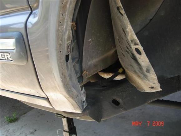 Remove the trim and peel the wheel wells back.