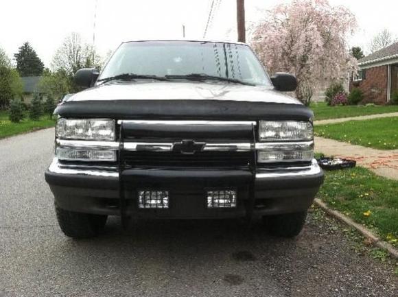 Front: Clear turn signals w/chrome bulbs; Push bar; Off-road driving lights; Painted Chevy emblem and tow hooks