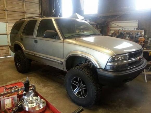 6in Rough Country suspension lift, '87 Camaro IROC-Z wheels that I painted, and some 32in BFG all terrain tires.