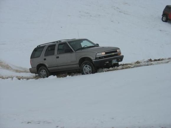 blazer playing in the sand pits in winter