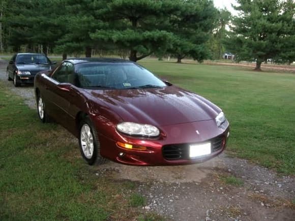 My first Camaro.  02 3800 V6/A4.  Burgundy w/ gray cloth.  T-tops.  Sold it in 2008.