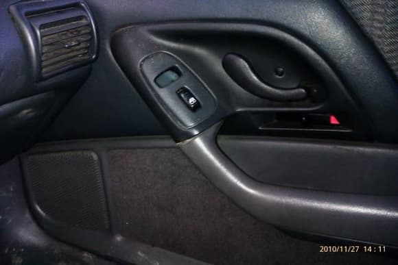 The passenger side power door lock switch is down in the door panel?  Need to get that out and mounted back up.