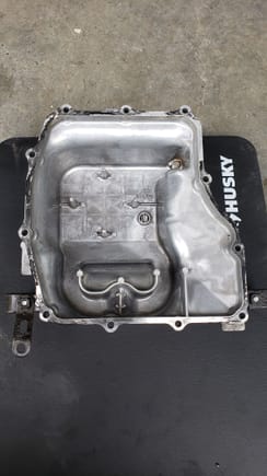 oil pan after cleaning with purple power and a plastic brush