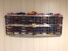 One more to go before it is full.  I used an old pheasant damaged grill from my 1990 full sized Blazer as a shelf for my 1/64 scale model Corvette collection.  I think some of the older model van grills could be used too.