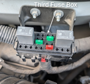 Located above and behind air-filter. 