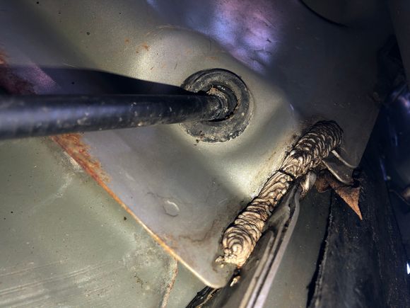 from outside, before parking brake cable was removed