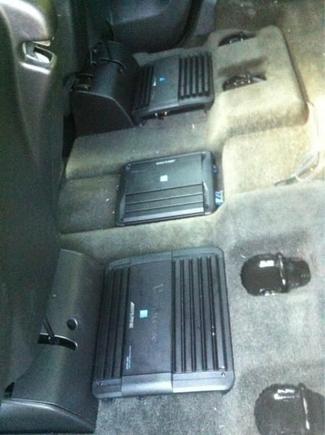 My alpine amps. This goes to show if you run out of room under the seats you can fit it between the seats.